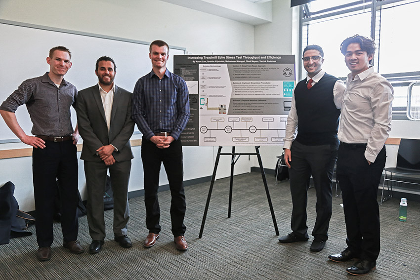 UW Medicine Echo Lab student group with poster