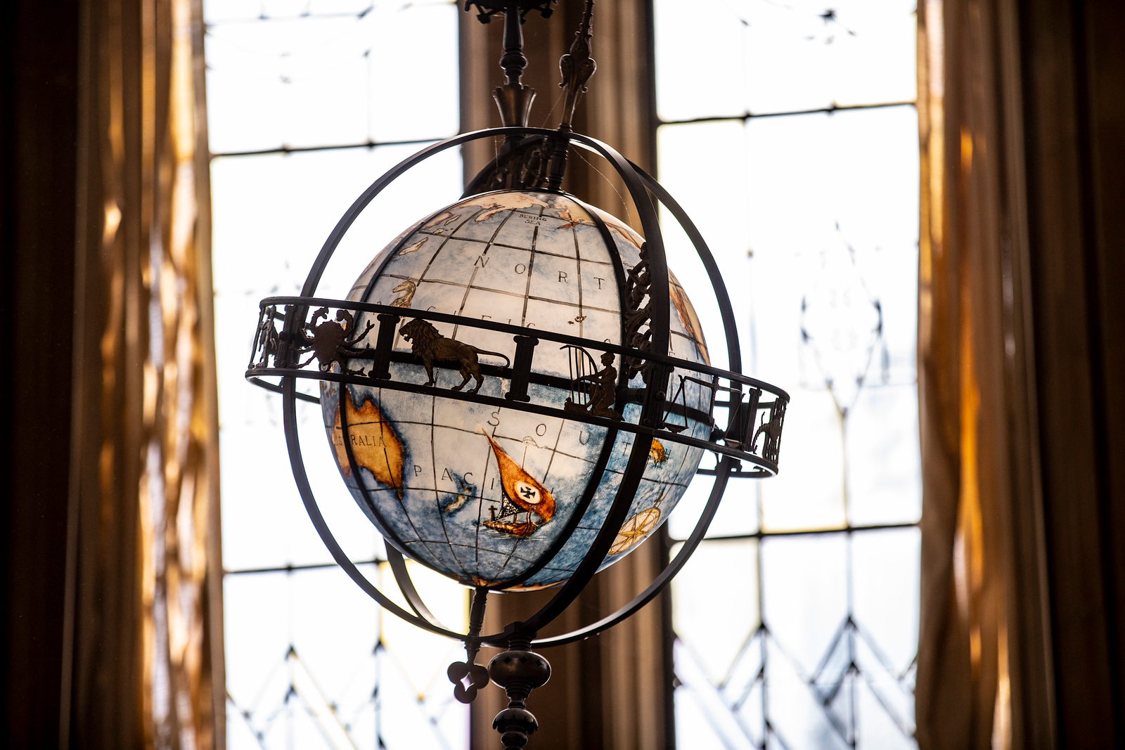 blue globe with circle metal frame around