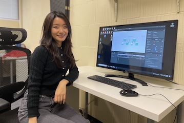 Jiaxin Li in front of a monitor