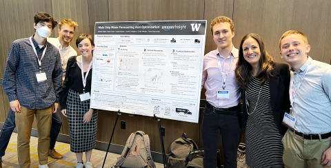 Professor Patty Buchanan and Students stand proudly around their prize-winning Capstone poster.